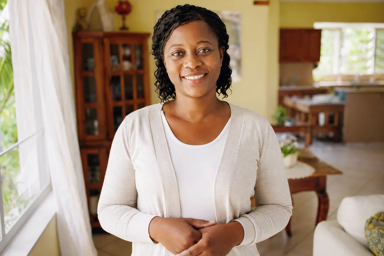 A professional caregiver in a Jamaican home — illustrative.